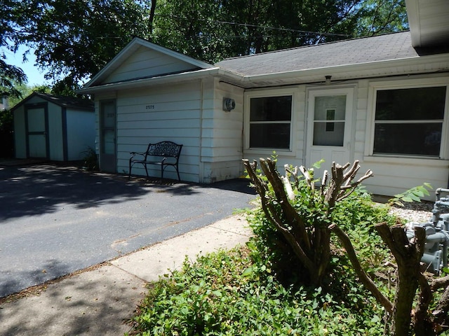 27375 W Nippersink Rd, Ingleside, IL 60041 - view of front of home featuring a shed and roof with shingles