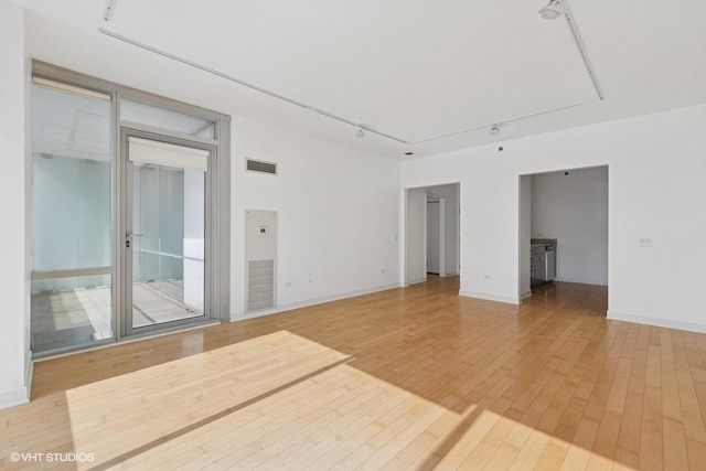 8 E Randolph St Unit 3007, Chicago, IL 60601 - spare room with light wood-type flooring and rail lighting