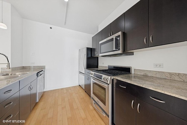 8 E Randolph St Unit 3007, Chicago, IL 60601 - kitchen with appliances with stainless steel finishes, dark cabinets, and light wood-style flooring