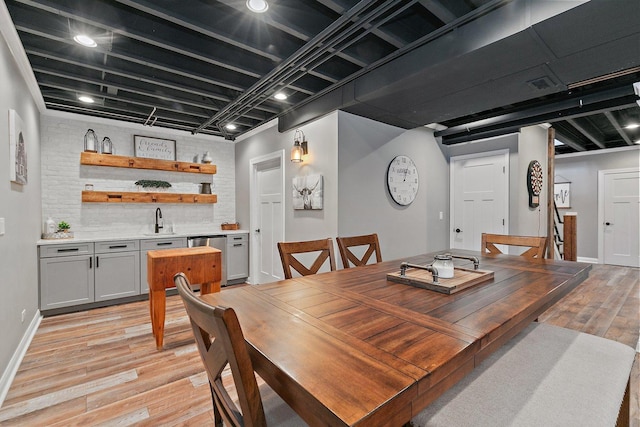 29990 Fehmarn Way, Genoa, IL 60135 - dining space featuring light wood-style floors and bar with sink