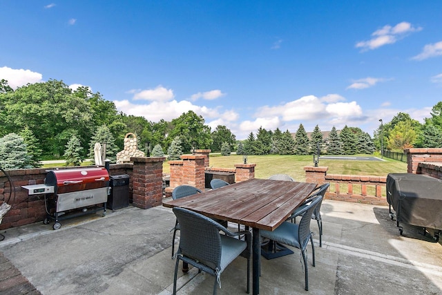 29990 Fehmarn Way, Genoa, IL 60135 - view of patio / terrace featuring outdoor dining area, a grill, and view of scattered trees
