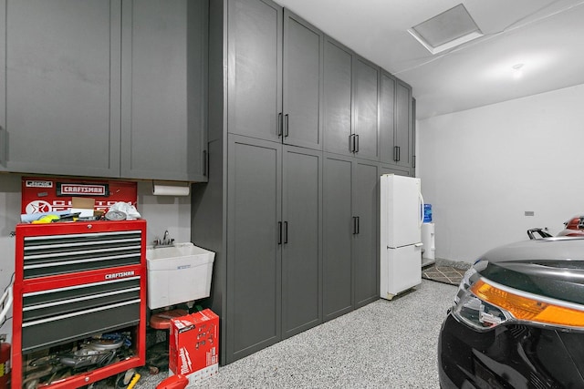29990 Fehmarn Way, Genoa, IL 60135 - garage featuring freestanding refrigerator and a sink