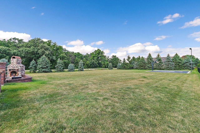 29990 Fehmarn Way, Genoa, IL 60135 - view of green lawn with an outdoor stone fireplace