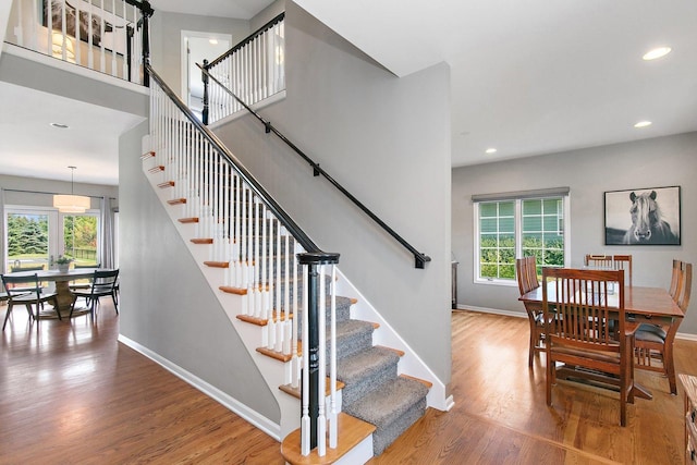 29990 Fehmarn Way, Genoa, IL 60135 - stairway featuring wood finished floors and recessed lighting