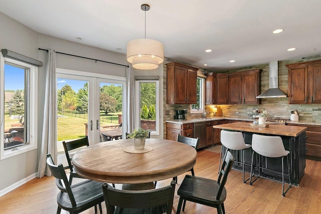 29990 Fehmarn Way, Genoa, IL 60135 - dining room with french doors, light wood finished floors, and recessed lighting