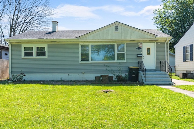 17317 Roy St, Lansing, IL 60438 - view of front of property featuring a front yard, roof with shingles, and a chimney