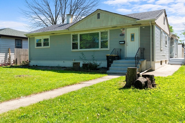 17317 Roy St, Lansing, IL 60438 - bungalow-style house with a shingled roof and a chimney