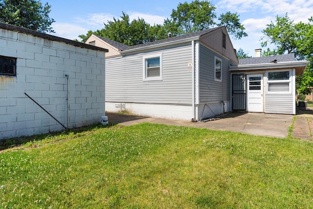 17317 Roy St, Lansing, IL 60438 - view of side of property with a yard, a patio, and roof with shingles