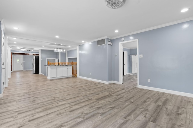 17317 Roy St, Lansing, IL 60438 - unfurnished living room featuring ornamental molding, light wood-style flooring, recessed lighting, and a chandelier