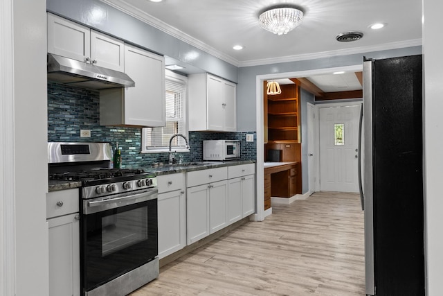 17317 Roy St, Lansing, IL 60438 - kitchen with stainless steel appliances, under cabinet range hood, light wood finished floors, crown molding, and white cabinetry