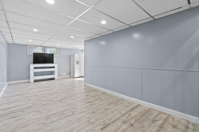 17317 Roy St, Lansing, IL 60438 - below grade area with wood finished floors, white fridge with ice dispenser, a drop ceiling, recessed lighting, and a wainscoted wall