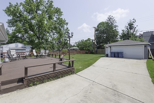 471 N W Ave, Elmhurst, IL 60126 - view of yard featuring outdoor dining space, a detached garage, a wooden deck, and an outbuilding