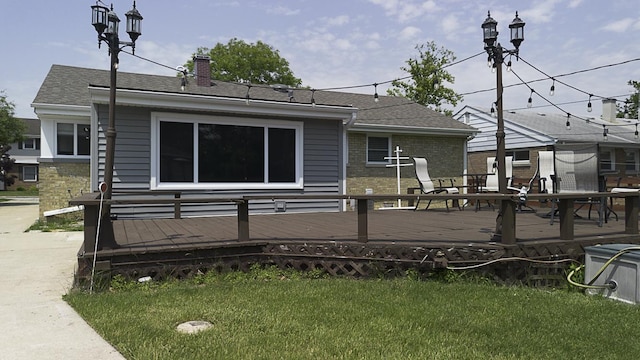 471 N W Ave, Elmhurst, IL 60126 - rear view of house with a deck, a lawn, a chimney, and a shingled roof