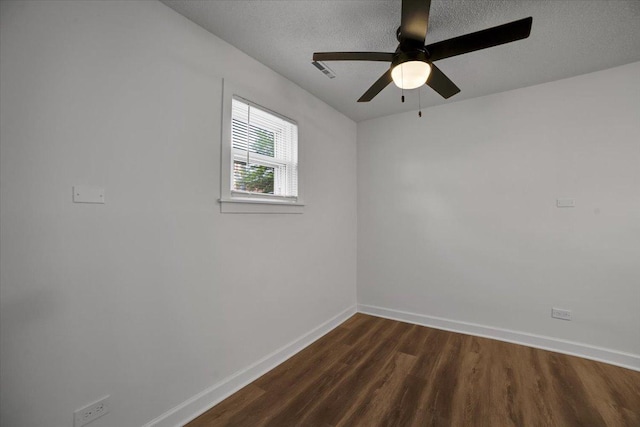 9444 Kelvin Ln Unit A-3211, Schiller Park, IL 60176 - empty room featuring dark wood-style floors, a textured ceiling, and a ceiling fan