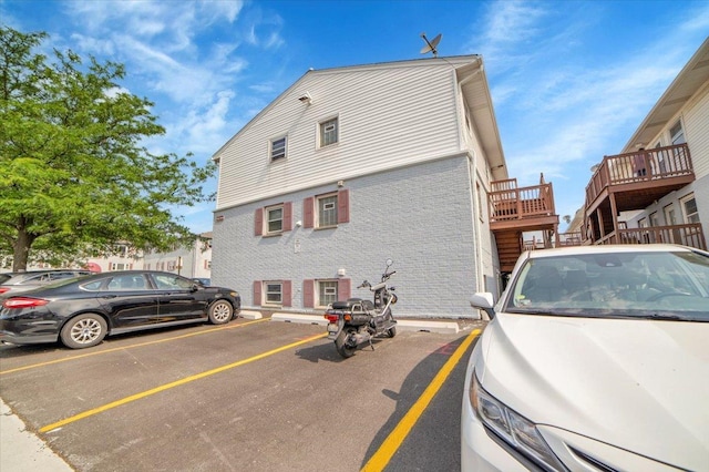 9444 Kelvin Ln Unit A-3211, Schiller Park, IL 60176 - view of side of home featuring uncovered parking and brick siding