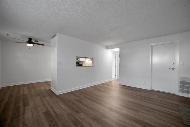 9444 Kelvin Ln Unit A-3211, Schiller Park, IL 60176 - unfurnished room with dark wood-type flooring, a textured ceiling, and ceiling fan