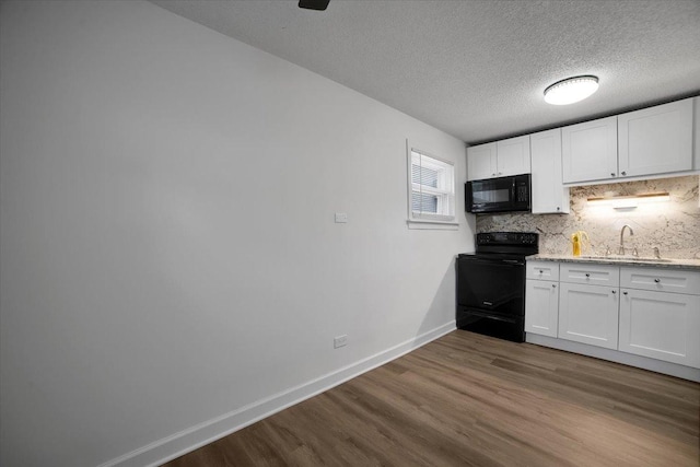 9444 Kelvin Ln Unit A-3211, Schiller Park, IL 60176 - kitchen featuring black appliances, dark wood-style flooring, white cabinets, backsplash, and a textured ceiling