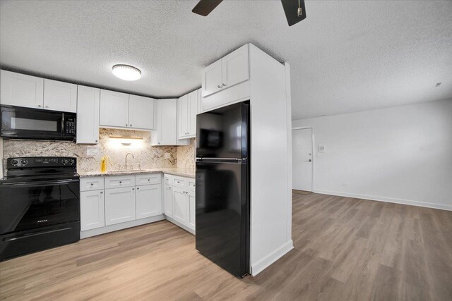 9444 Kelvin Ln Unit A-3211, Schiller Park, IL 60176 - kitchen featuring black appliances, light wood-style floors, ceiling fan, white cabinetry, and a textured ceiling