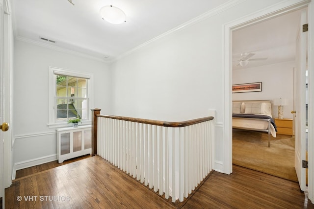 100 13th St, Wilmette, IL 60091 - hallway featuring an upstairs landing, wood finished floors, and ornamental molding