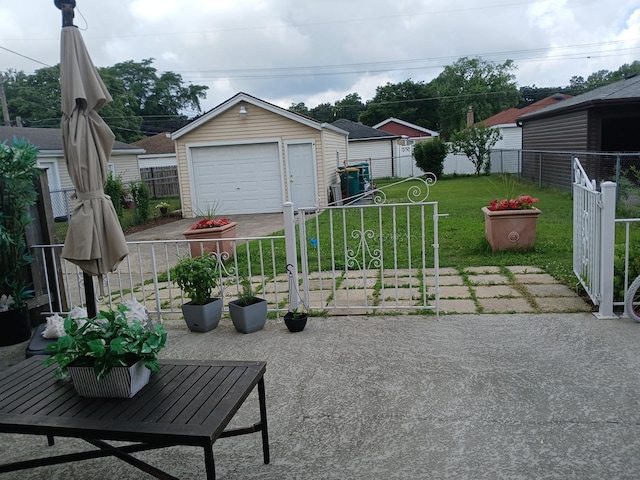 4324 S Wisconsin Ave, Berwyn, IL 60404 - view of patio featuring a garage, concrete driveway, and an outdoor structure