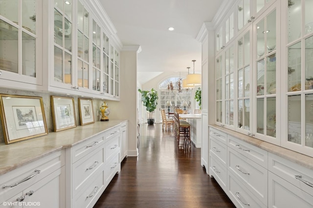 475 Red Fox Ln, Lake Forest, IL 60045 - bar featuring dark wood-type flooring, hanging light fixtures, recessed lighting, a chandelier, and crown molding