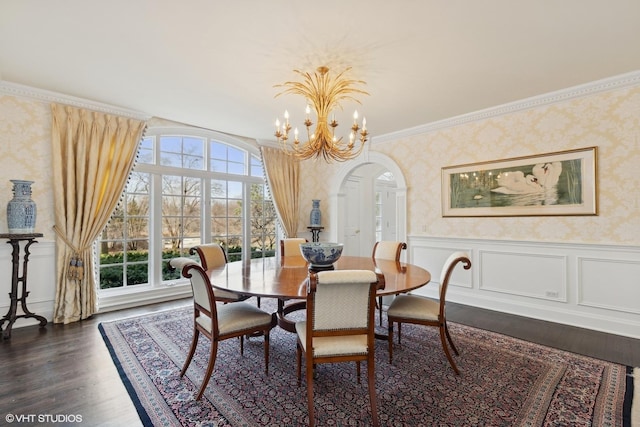 475 Red Fox Ln, Lake Forest, IL 60045 - dining room featuring wallpapered walls, a wainscoted wall, dark wood-style floors, a chandelier, and arched walkways
