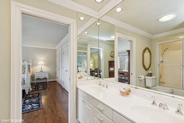 475 Red Fox Ln, Lake Forest, IL 60045 - ensuite bathroom with ornamental molding, double vanity, a shower with door, wood finished floors, and recessed lighting