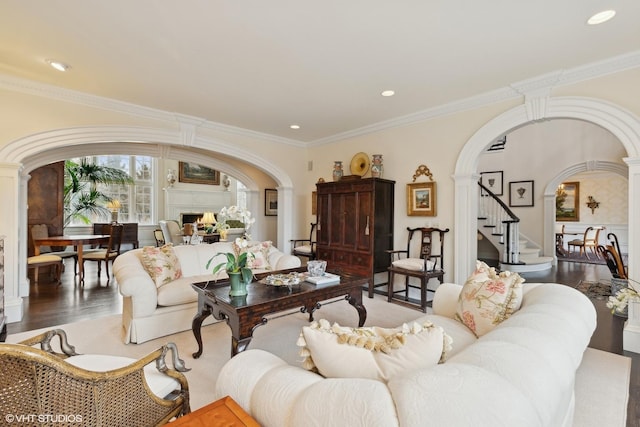 475 Red Fox Ln, Lake Forest, IL 60045 - living room with stairs, arched walkways, decorative columns, ornamental molding, and wood finished floors