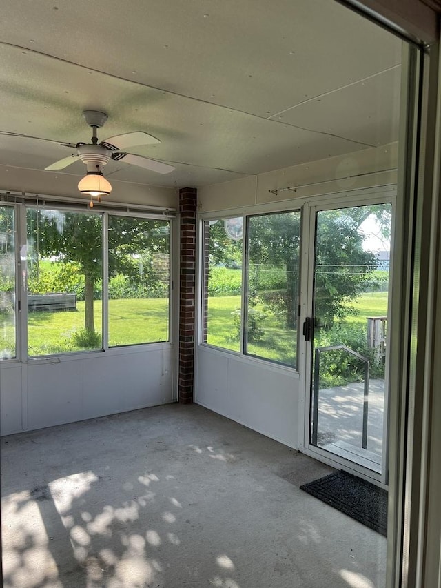 422 N 4th St, Cissna Park, IL 60924 - unfurnished sunroom featuring plenty of natural light and a ceiling fan