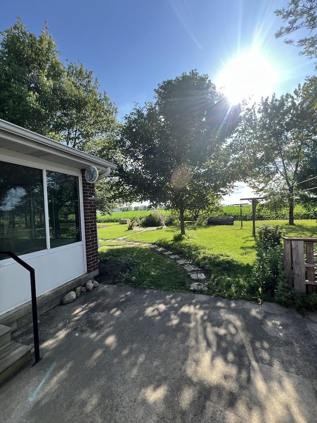 422 N 4th St, Cissna Park, IL 60924 - view of patio / terrace with a sunroom