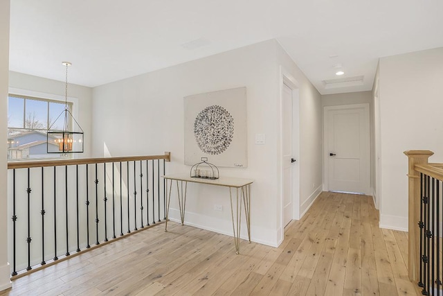 1104 Walter St, Lemont, IL 60439 - hallway featuring a chandelier, light wood-type flooring, an upstairs landing, and recessed lighting