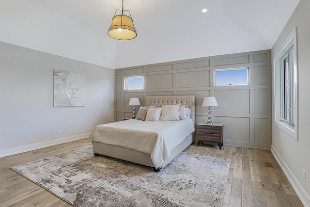 1104 Walter St, Lemont, IL 60439 - bedroom with a decorative wall, light wood-style flooring, and high vaulted ceiling