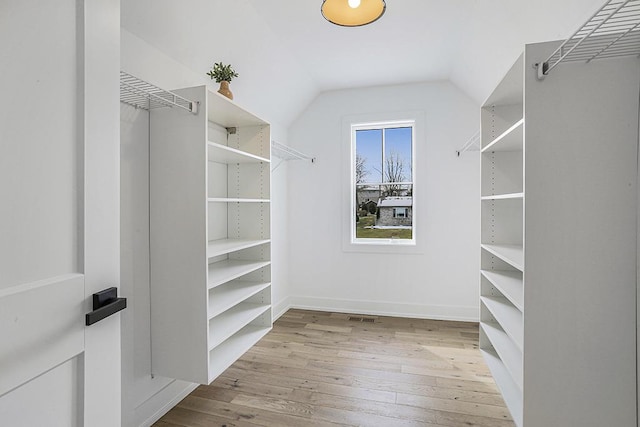 1104 Walter St, Lemont, IL 60439 - walk in closet with hardwood / wood-style flooring and lofted ceiling