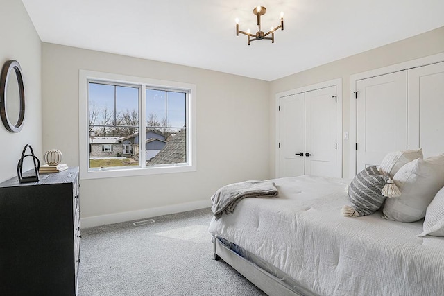 1104 Walter St, Lemont, IL 60439 - bedroom featuring multiple closets, a chandelier, and carpet