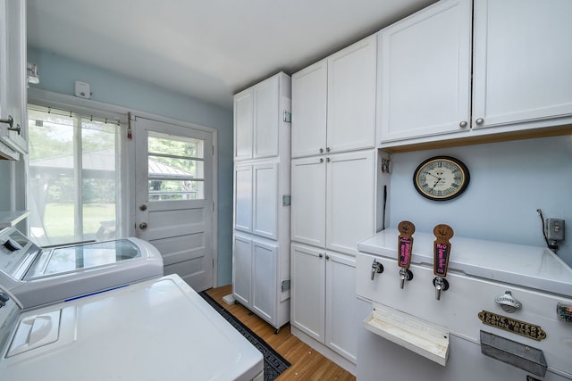 131 N Pierce Ave, Wheaton, IL 60187 - laundry room with independent washer and dryer, cabinet space, and light wood-style floors