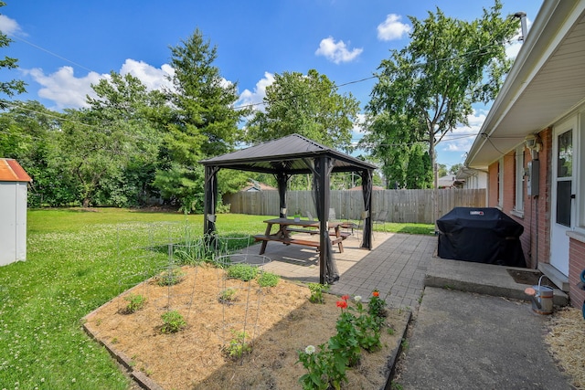 131 N Pierce Ave, Wheaton, IL 60187 - fenced backyard with a gazebo, a patio area, and a garden