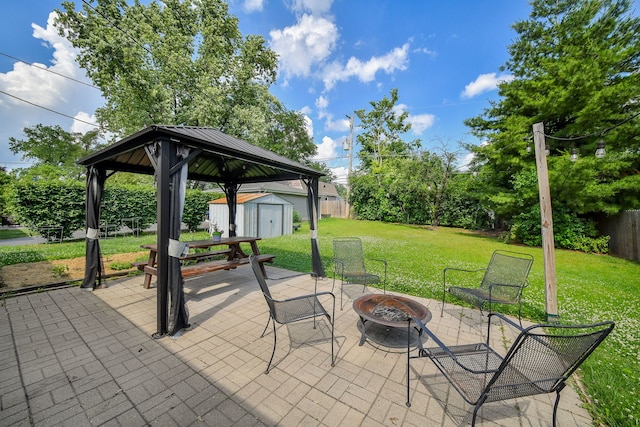 131 N Pierce Ave, Wheaton, IL 60187 - fenced backyard featuring a shed, an outdoor fire pit, a patio, and a gazebo