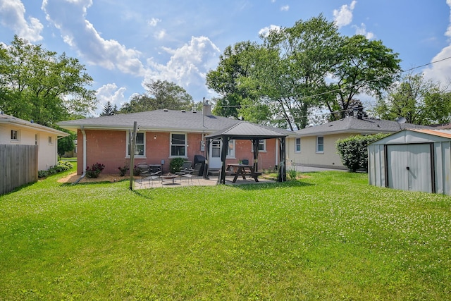 131 N Pierce Ave, Wheaton, IL 60187 - rear view of house featuring a patio area, a storage unit, brick siding, and a fire pit