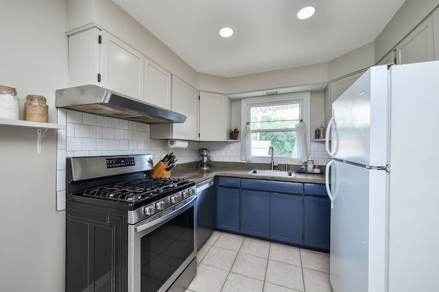 131 N Pierce Ave, Wheaton, IL 60187 - kitchen with appliances with stainless steel finishes, ventilation hood, blue cabinets, open shelves, and backsplash
