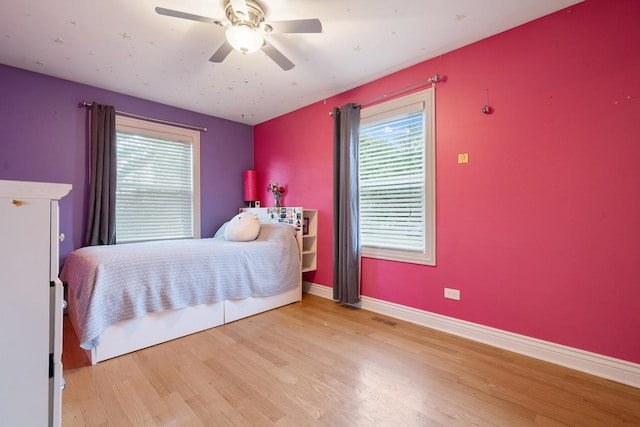 1024 Inverrary Ln Unit 1024, Deerfield, IL 60015 - bedroom with wood finished floors and ceiling fan