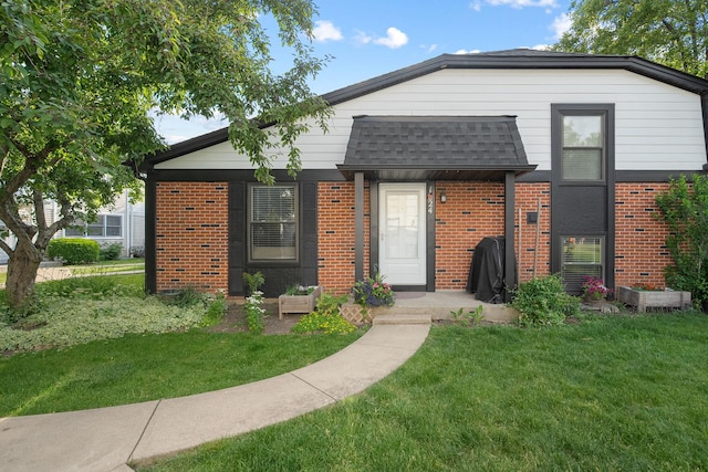 1024 Inverrary Ln Unit 1024, Deerfield, IL 60015 - view of front of property featuring brick siding and a front lawn