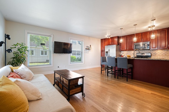 1024 Inverrary Ln Unit 1024, Deerfield, IL 60015 - living area featuring light wood-style floors and healthy amount of natural light