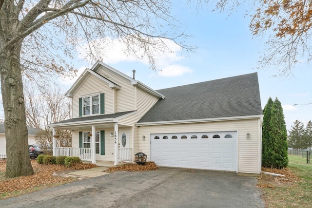 1654 Hilda Dr, Lake Holiday, IL 60548 - traditional home featuring a porch, driveway, an attached garage, and a shingled roof