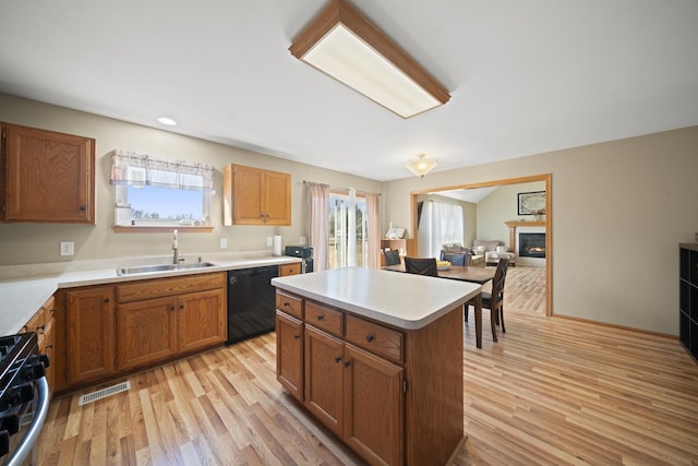 1654 Hilda Dr, Lake Holiday, IL 60548 - kitchen featuring dishwasher, range with gas cooktop, plenty of natural light, light wood-style flooring, and recessed lighting