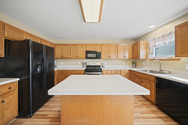 1654 Hilda Dr, Lake Holiday, IL 60548 - kitchen with black appliances, light wood finished floors, and light countertops