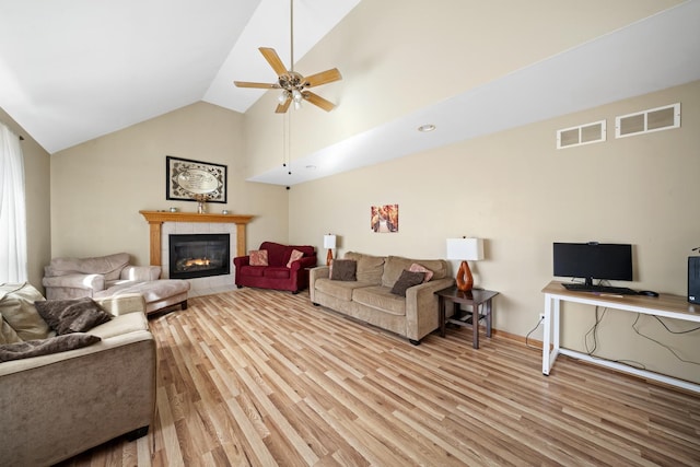 1654 Hilda Dr, Lake Holiday, IL 60548 - living area with light wood-style flooring, lofted ceiling, ceiling fan, and a tile fireplace