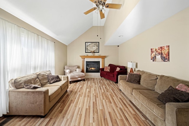 1654 Hilda Dr, Lake Holiday, IL 60548 - living area featuring light wood-style flooring, ceiling fan, a fireplace, and lofted ceiling
