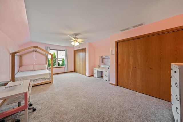 1654 Hilda Dr, Lake Holiday, IL 60548 - unfurnished bedroom featuring two closets, carpet floors, ceiling fan, and vaulted ceiling