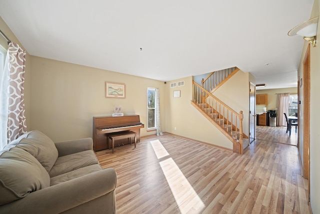 1654 Hilda Dr, Lake Holiday, IL 60548 - living area with light wood finished floors and stairway