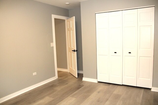 3042 Bar Harbour Rd, Aurora, IL 60504 - unfurnished bedroom featuring wood finished floors and a closet